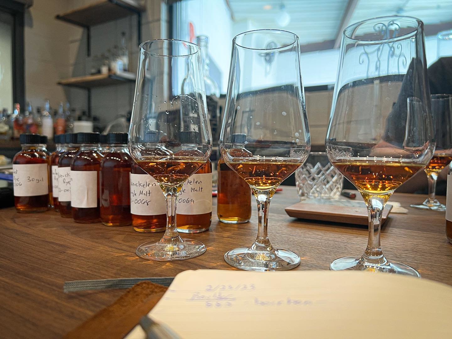 Row of glasses with whiskey for tasting